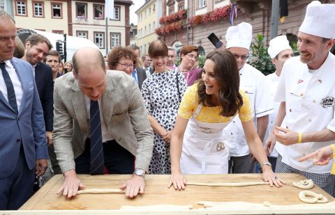 William and Kate attempt to make pretzels on July 20, during a tour of Heidelberg's traditional German market.