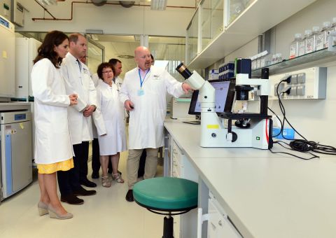 The duke and duchess don lab coats during a visit on July 20, with researchers at the German Cancer Research Institute in Heidelberg.