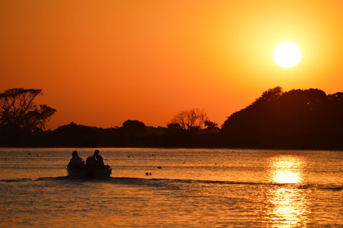 The sun sets over the Rio Cuiba in Brazil's Pantanal wetlands.