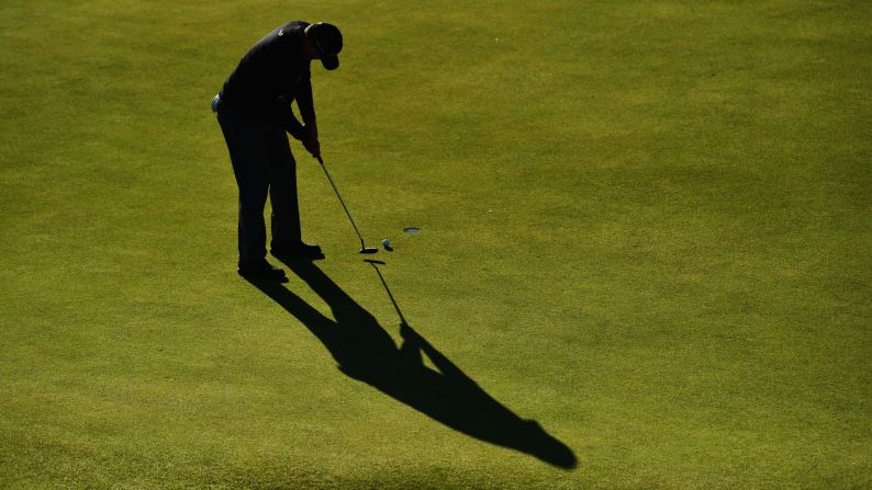 Paul Lawrie of Scotland putts on the 17th green.