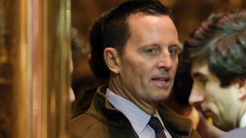 Richard Grenell, left, arrives in Trump Tower, in New York, Monday, Dec. 12, 2016. (AP Photo/Richard Drew)