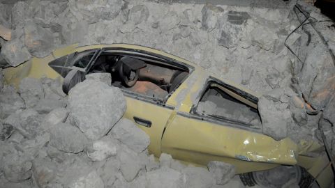 A car is enveloped in rubble on Kos in the wake of the earthquake. 