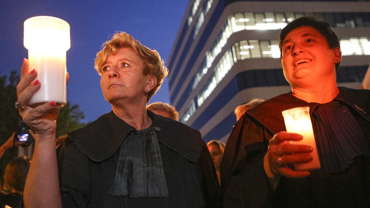 Judges join protests at a "Chain of Light" rally in Krakow.