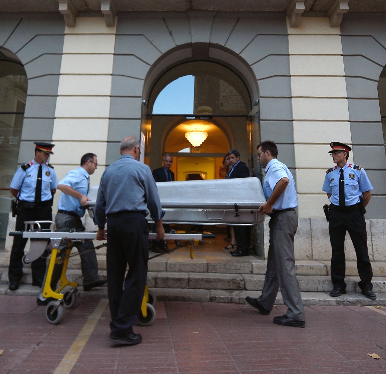 A casket is taken inside the Teatre-Museu Dali (Theatre-Museum Dali) with forensic examiners for the exhumation of Salvador Dali's remains in Figueras on July 20, 2017.