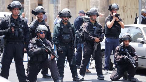 Israeli security forces take security measures as Palestinians gather for Friday prayers outside Herod's Gate in Jerusalem.