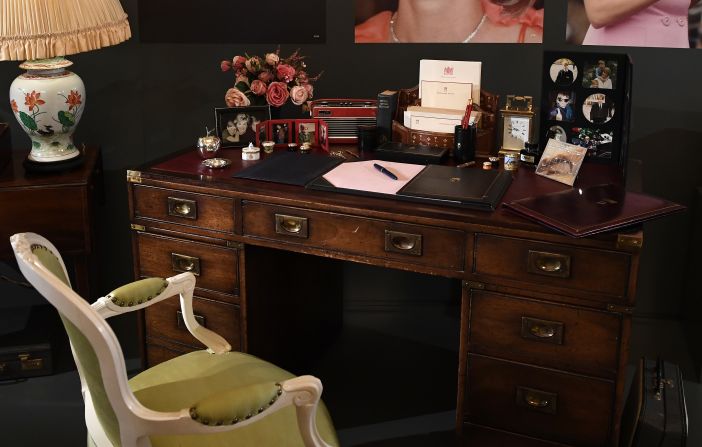 The centerpiece of the display is Diana's desk. It was here that she would sit and work, writing letters and reading official briefings. The desk has been arranged to reflect Diana's favorite trinkets, including photographs of her sons.