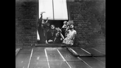 There's no sense of wonder or excitement here. Even as recently as the 1920s, eclipses were still regarded with fear. This group gathered in a window to view the total solar eclipse over London through smoked glass -- touted as a safe method at the time -- in June 1927. 