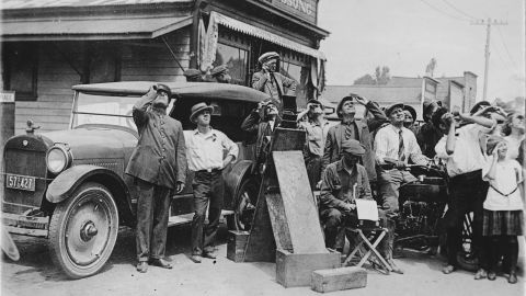 A crowd in a California town observes the total eclipse of the sun in September 1923.