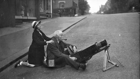 Amateur astronomers and spectators got up early to witness and photograph a total eclipse of the sun in London in 1936. 