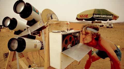 An astronomer with Educational Expedition International in Mauritania's desert uses astronomical equipment to view a total solar eclipse in 1973.