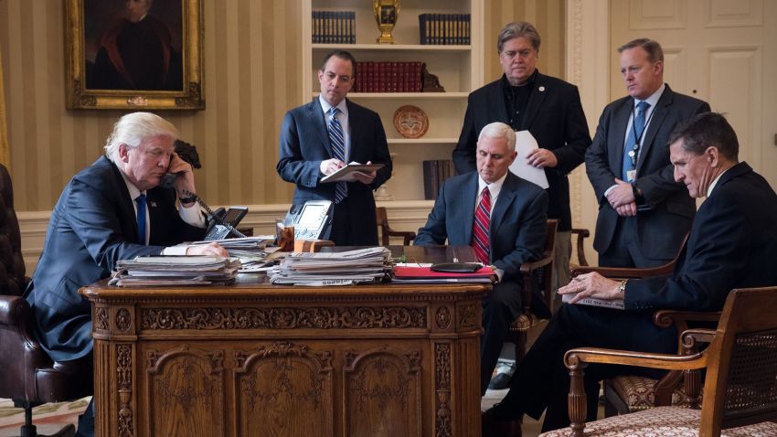 WASHINGTON, DC - JANUARY 28: President Donald Trump speaks on the phone with Russian President Vladimir Putin in the Oval Office of the White House, January 28, 2017 in Washington, DC. Also pictured, from left, White House Chief of Staff Reince Priebus, Vice President Mike Pence, White House Chief Strategist Steve Bannon, Press Secretary Sean Spicer and National Security Advisor Michael Flynn. On Saturday, President Trump is making several phone calls with world leaders from Japan, Germany, Russia, France and Australia. (Photo by Drew Angerer/Getty Images)