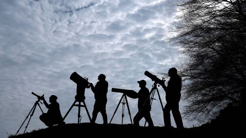 Members of the Galloway Forest Astronomical Society prepare their equipment ahead of the solar eclipse on March 19, 2015 in Newton Stewart, Scotland.