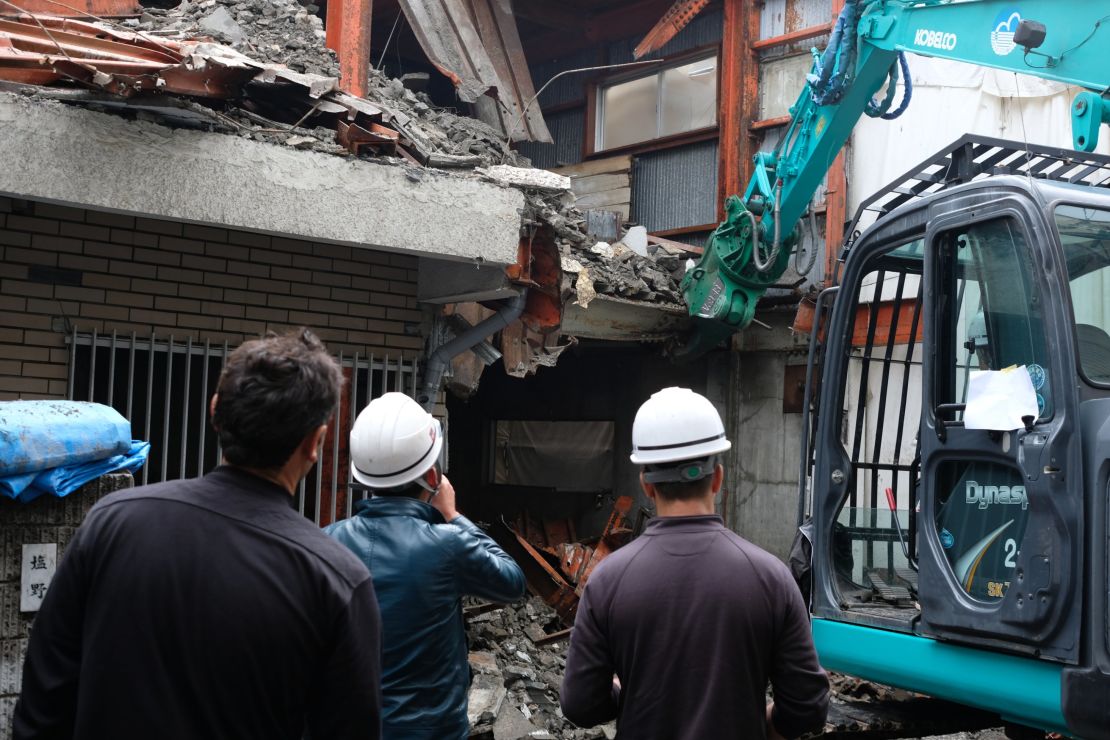 Kurdish demolition workers survey a derelict building in Saitama, Japan.