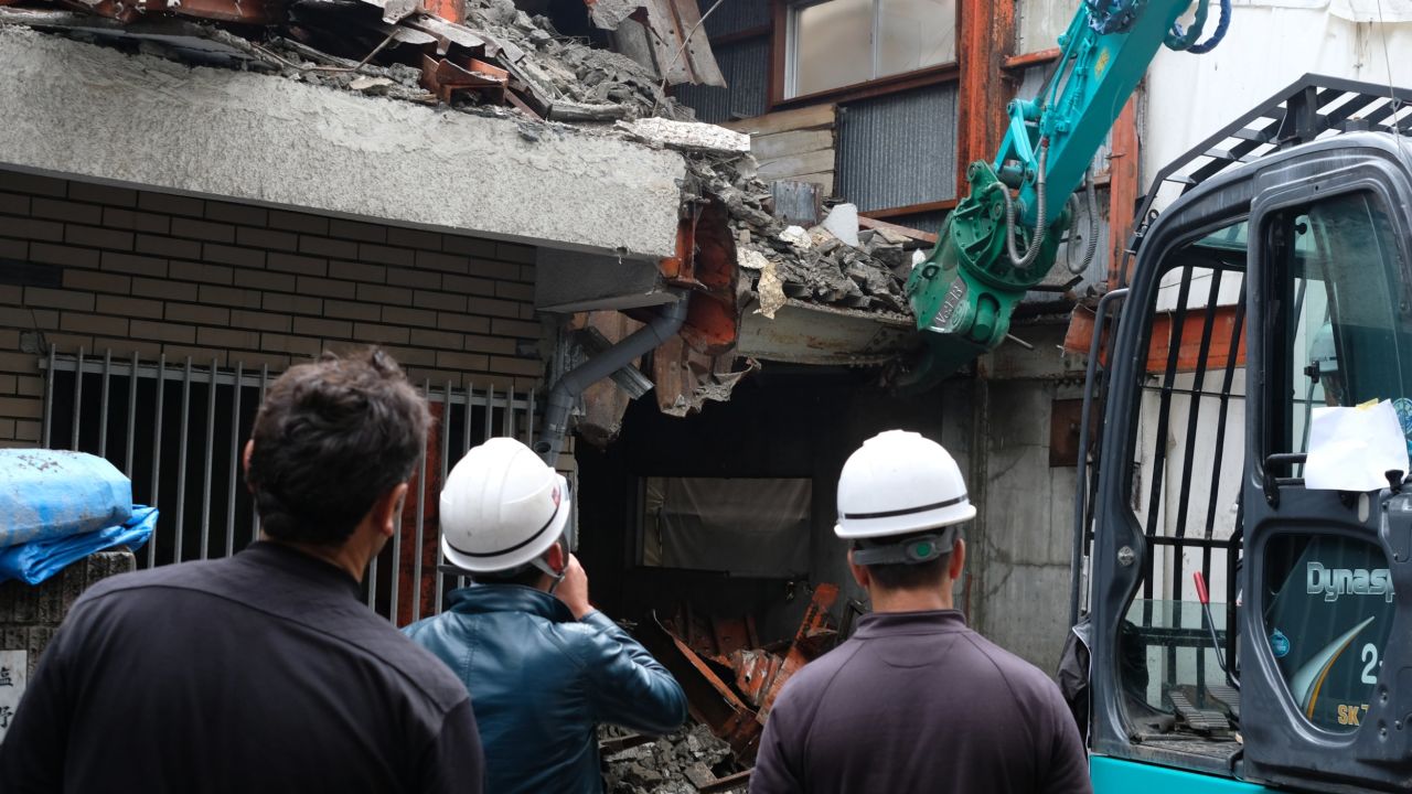 Kurdish demolition workers survey a derelict building in Saitama, Japan.