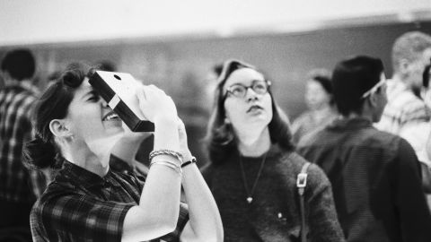 Students using the pinhole technique to view the solar eclipse on February 27, 1958.