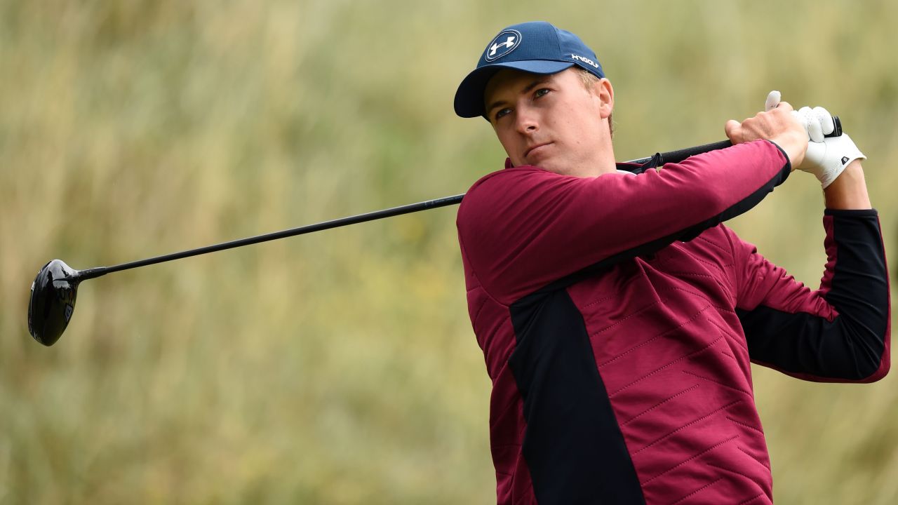 Spieth weathered strong winds and heavy rain to lead the British Open by two shots at halfway at Royal Birkdale.