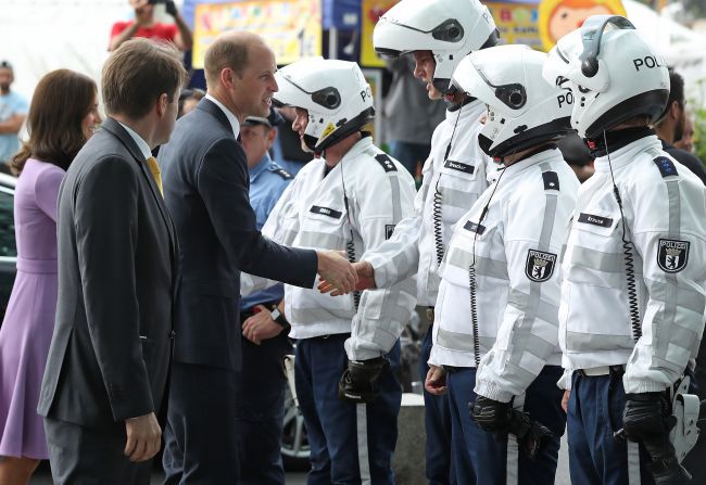 Catherine and William say goodbye to German police officers who had led their motorcade on motorcycles at Berlin Hauptbahnhof main railway station before departing for Hamburg on July 21.