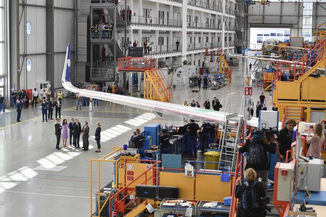 The royal couple tours the Airbus training facilities with Klaus Richter, chief procurement officer for Airbus, Marco Wagner, human resources director for Airbus in Germany, and Hamburg Mayor Olaf Scholz.