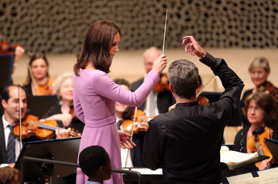Catherine receives lessons on how to conduct an orchestra at Elbphilharmonie in Hamburg on Friday.