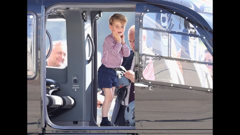 Prince George and Prince William view helicopter models H145 and H135 before departing from Hamburg on the last day of their official visit to Germany.
