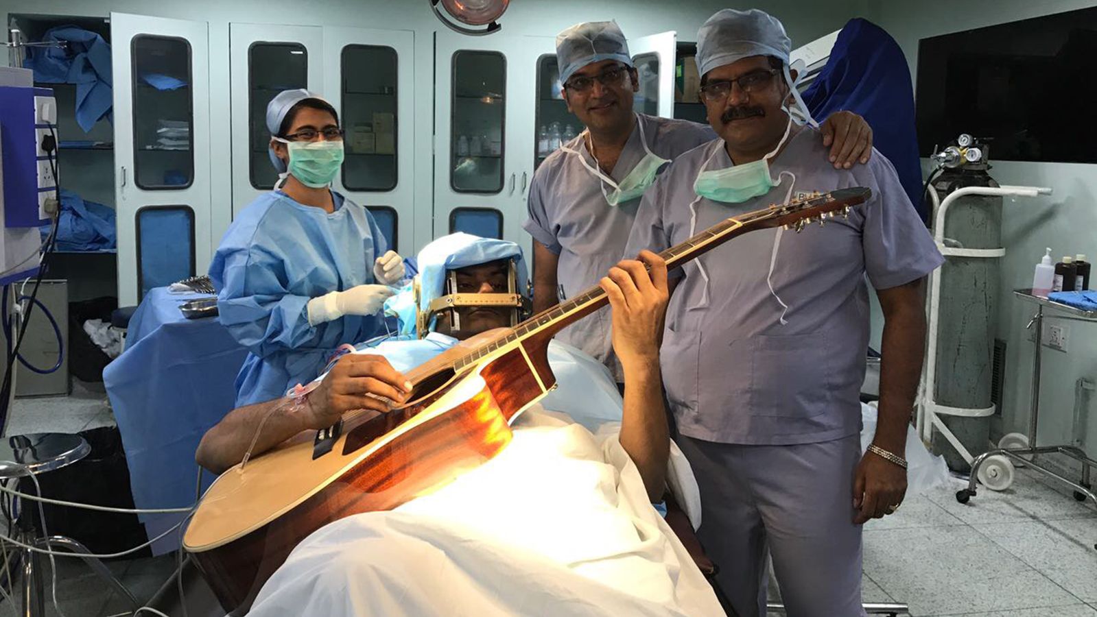 Abhishek Prasad was awake and encouraged to play the guitar while undergoing brain surgery on July 11, 2017, in Bangalore, India.