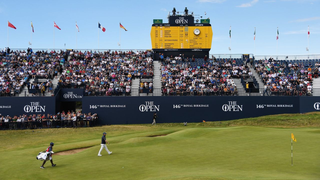 South Africa's Branden Grace walks to the 18th green on his way to shooting the first 62 in the history of men's majors Saturday.