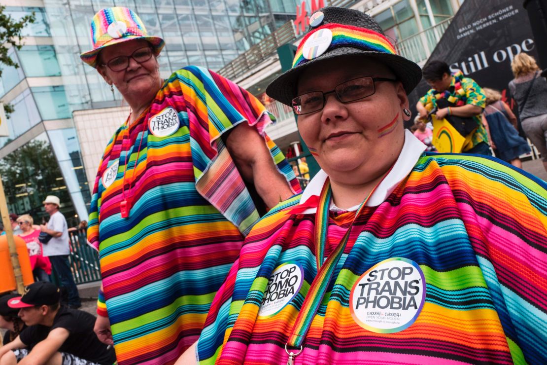 Dressed in vibrant, multi-colored outfits, some participants worn "Stop transphobia" stickers as well. 