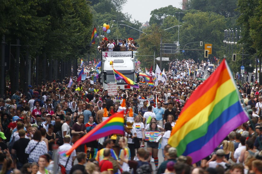 Paradegoers march alongside decorated trucks on Saturday during the 2017 Christopher Street Day gay pride celebration in Berlin, Germany.