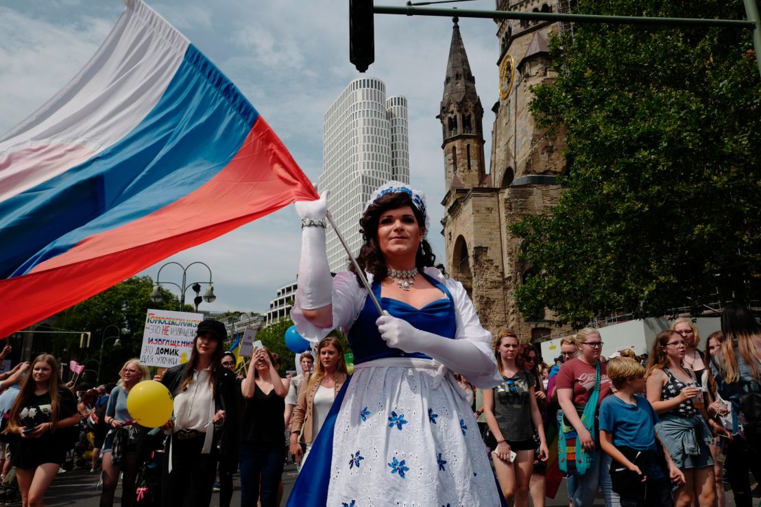 The parade saw people of all nationalities -- like this participant from Russia -- join the festivities. 