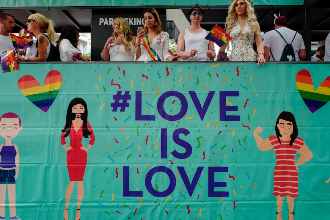 Participants ride in a "Love is Love" float during Berlin's annual Christopher Street Day gay pride parade in July 2017.

