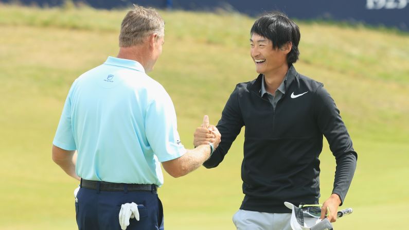 Haotong Li of China, right, shot a closing 63 to set the clubhouse target at six under. He ended third, six shots adrift of Spieth.