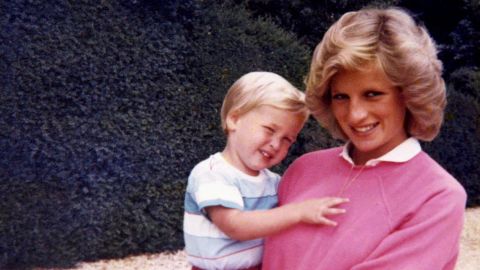 Diana, Princess of Wales, holding Prince William while pregnant with Prince Harry.