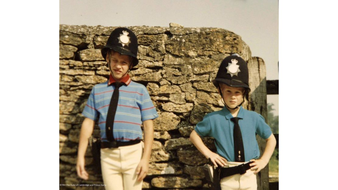 Princes William and Harry dress in UK police uniforms.