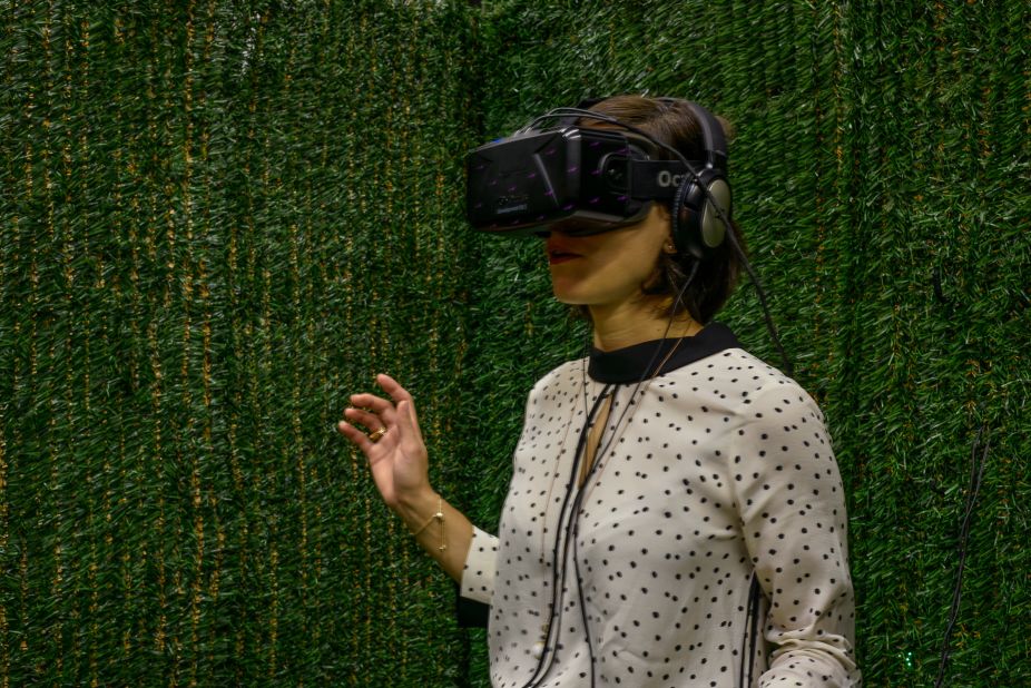 A visitor experiencing Jon Rafman's virtual reality work "Sculpture Garden (Hedge Maze)" (2015) at the Zabludowicz Collection in London. 