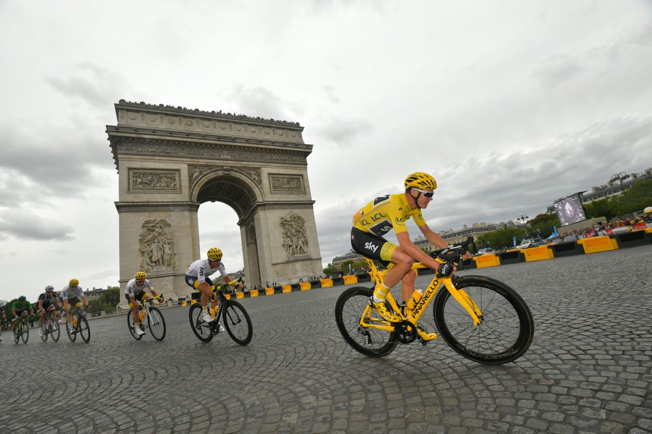 Against the backdrop of the Arc de Triomphe, Britain's Chris Froome rides to his fourth Tour de France win.