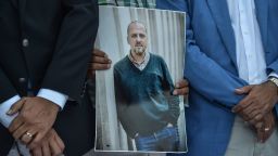 A man holds a portrait of jailed investigative journalist Ahmet Sik on July 24, 2017 during a demonstration outside Istanbul's courthouse.
Seventeen directors and journalists from Cumhuriyet, one of Turkey's most respected opposition newspapers, go on trial on July 24 after spending over eight months behind bars in a case which has raised new alarm over press freedoms under President Recep Tayyip Erdogan. / AFP PHOTO / OZAN KOSE        (Photo credit should read OZAN KOSE/AFP/Getty Images)