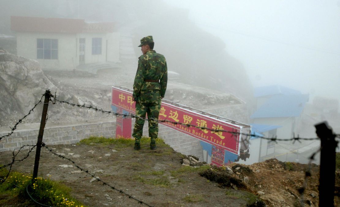 A Chinese soldier stands guard on the Chinese side of the ancient Nathu La border crossing between India and China in 2008.