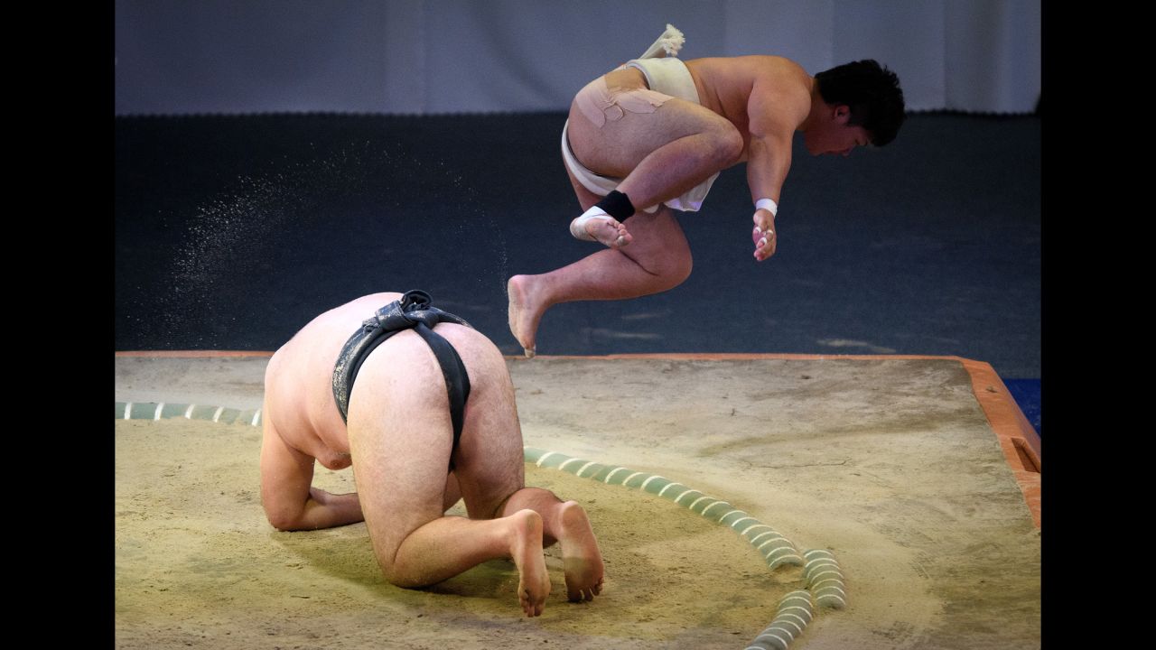 Japan's Hayato Miwa jumps over Ukraine's Oleksandr Veresiuk during a World Games sumo match on Sunday, July 23. Miwa won the match and eventually took bronze in the open-weight finals.