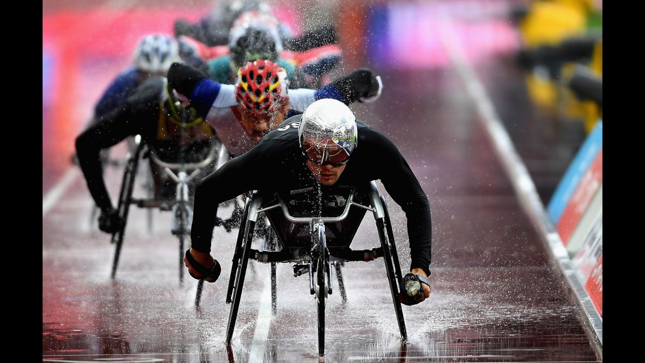 Swiss Paralympian Marcel Hug leads a pack of racers at the World Para Athletics Championships on Sunday, July 23. He won the T54 5,000 meters.