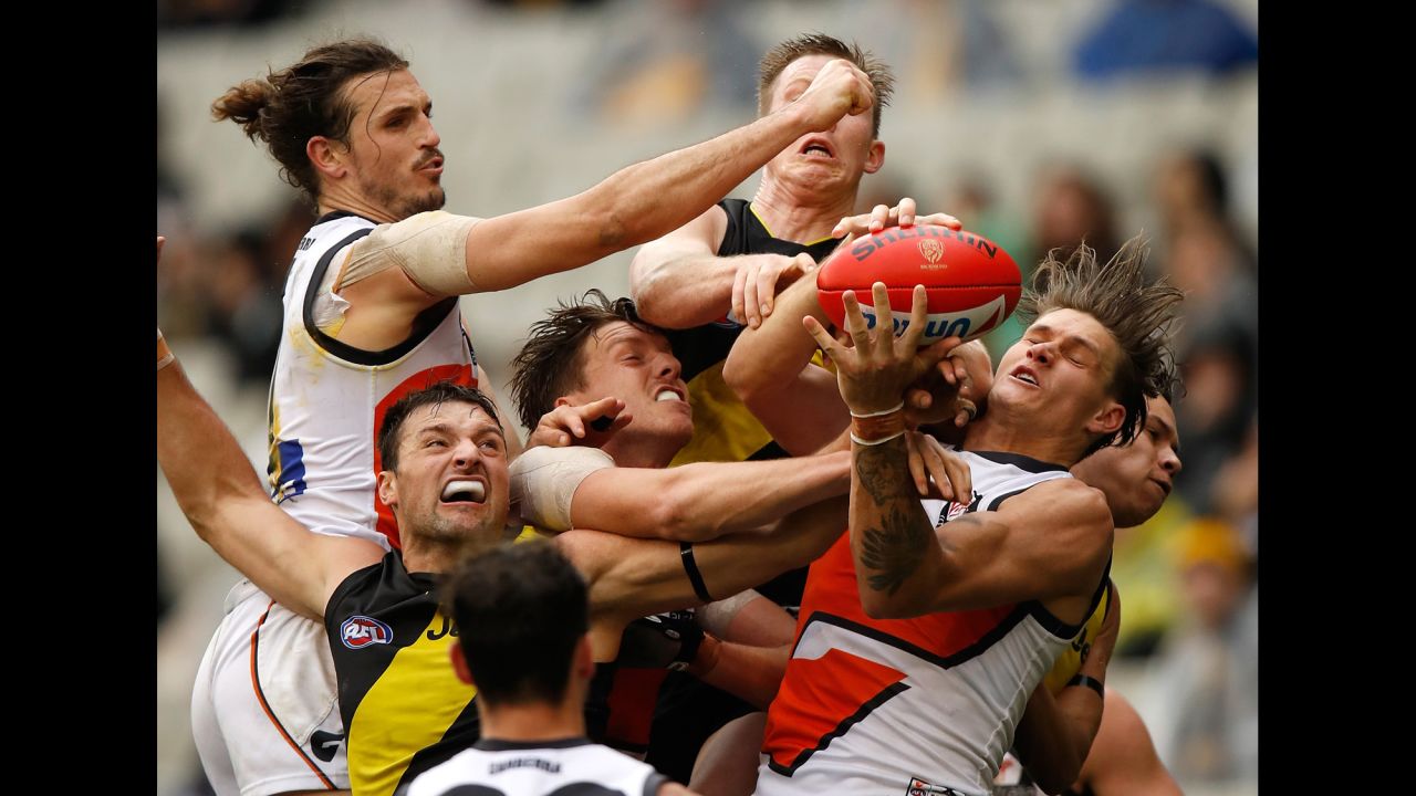 Players from the Richmond Tigers and the Greater Western Sydney Giants compete for the ball during an Australian Football League match on Sunday, July 23.