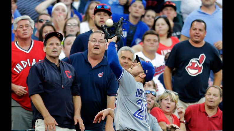 Toronto's Josh Donaldson catches a foul ball during a Major League Baseball game in Cleveland on Saturday, July 22.