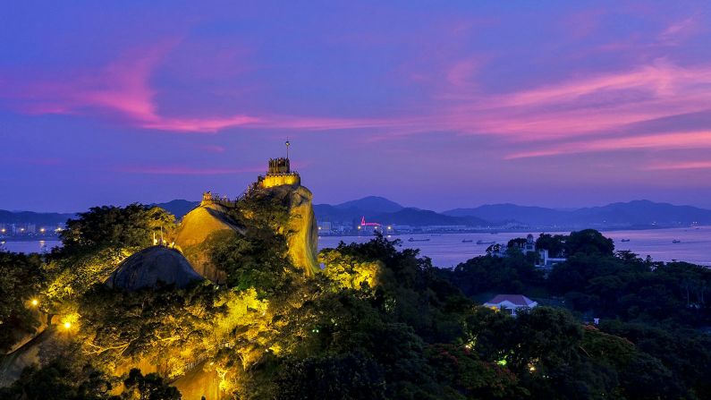 <strong>The best views: </strong>The 302-foot-tall Sunlight Rock, the highest point on the island, offers views of the island's red rooftops and of Xiamen across the strait.