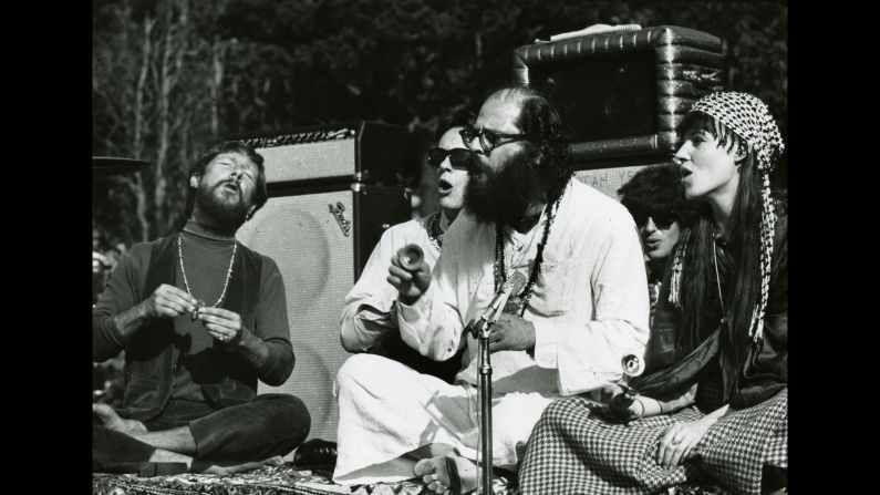 <strong>The beat poets:</strong> Gary Snyder (from left), Michael McClure and Allen Ginsberg, Hell's Angel Freewheelin Frank and Ginsburg's girlfriend Maretta Greer lead the crowd in a massive chant at the Be-In, in another photo by Gene Anthony.