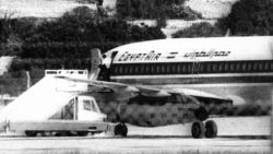 One of the three hijackers of EgyptAir flight 648 appears at the open doorway at Luqa airport in Valletta, Malta, Nov. 24, 1985.  The jet bound for Athens was diverted to Malta on Nov. 23 by the Abu Nidal Group.  (AP Photo/Pardi)