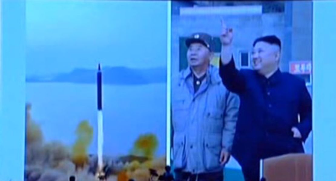 Kim Jong Un watches a test of an intermediate-range ballistic missile, the Hwasong-12.