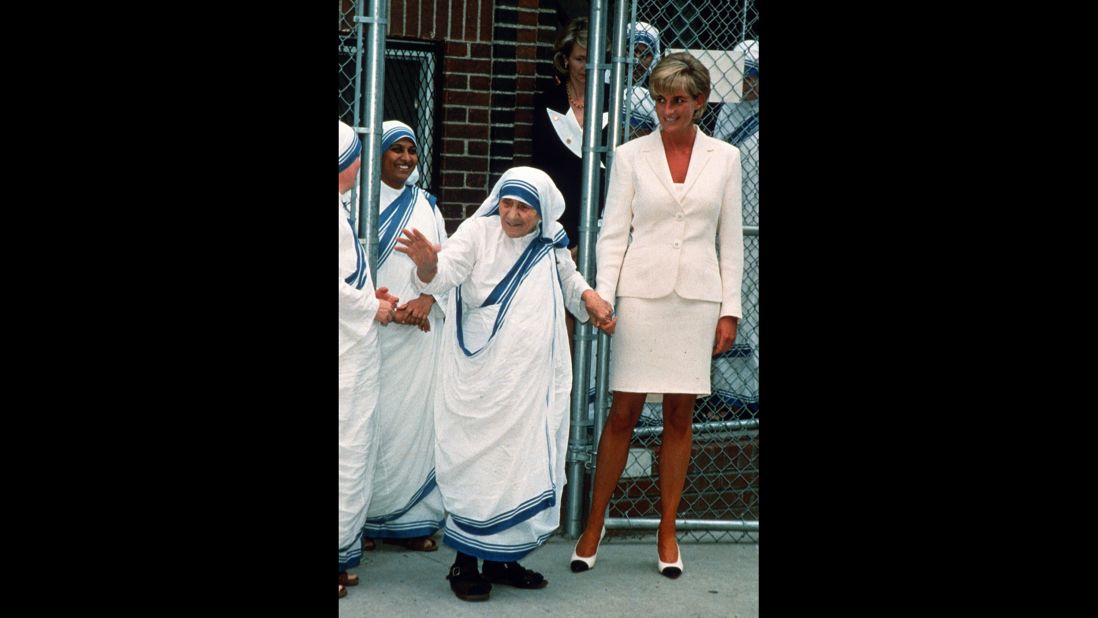 Diana holds hands with Mother Teresa after they met in New York in June 1997.