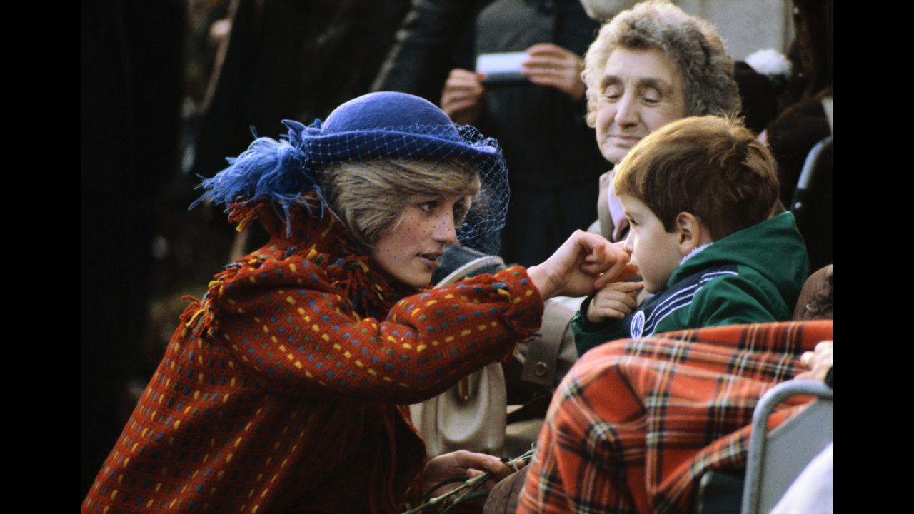 Diana greets a child while visiting Wrexham, Wales, in November 1982.