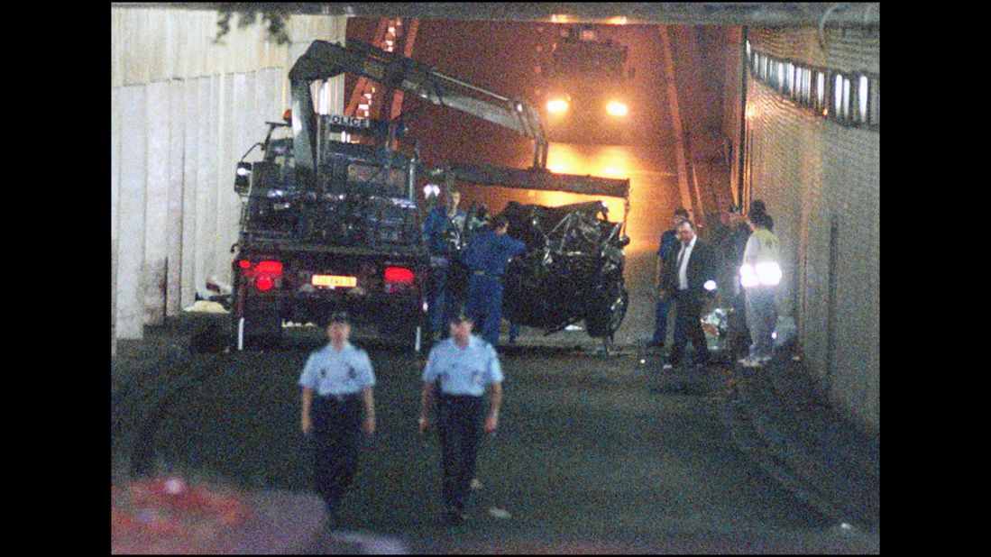Wreckage is lifted away after the car Diana was in crashed into a pillar on August 31, 1997. Fayed and driver Henri Paul died at the scene. Diana died at a Paris hospital a few hours later. A French investigation concluded that Paul was legally drunk at the time and responsible for the accident. In 2008, a British coroner's jury found that Diana and Fayed were unlawfully killed because of the actions of Paul and pursuing paparazzi.
