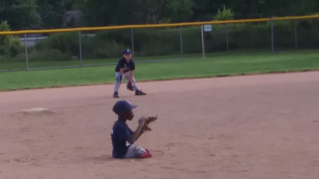 Gabe Davis playing outfield at a Berea Tigers game.