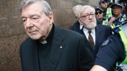 MELBOURNE, AUSTRALIA - JULY 26:  Cardinal George Pell and his barrister Robert Richter leave the Melbourne Magistrates Court with a heavy police guard in Melbourne on July 26, 2017 in Melbourne, Australia. Cardinal Pell was charged on summons by Victoria Police on 29 June over multiple allegations of sexual assault. Cardinal Pell is Australia's highest ranking Catholic and the third most senior Catholic at the Vatican, where he was responsible for the church's finances. Cardinal Pell has leave from his Vatican position while he defends the charges.  (Photo by Darrian Traynor/Getty Images)